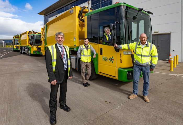 Two of the new bin lorries outside Bankhead Depot with representatives from FC and Hillend Engineering