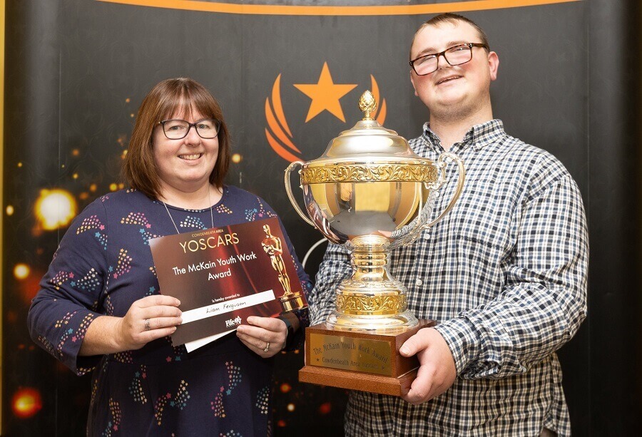 Liam Ferguson receiving The McKain award from Kirsteen Henderson