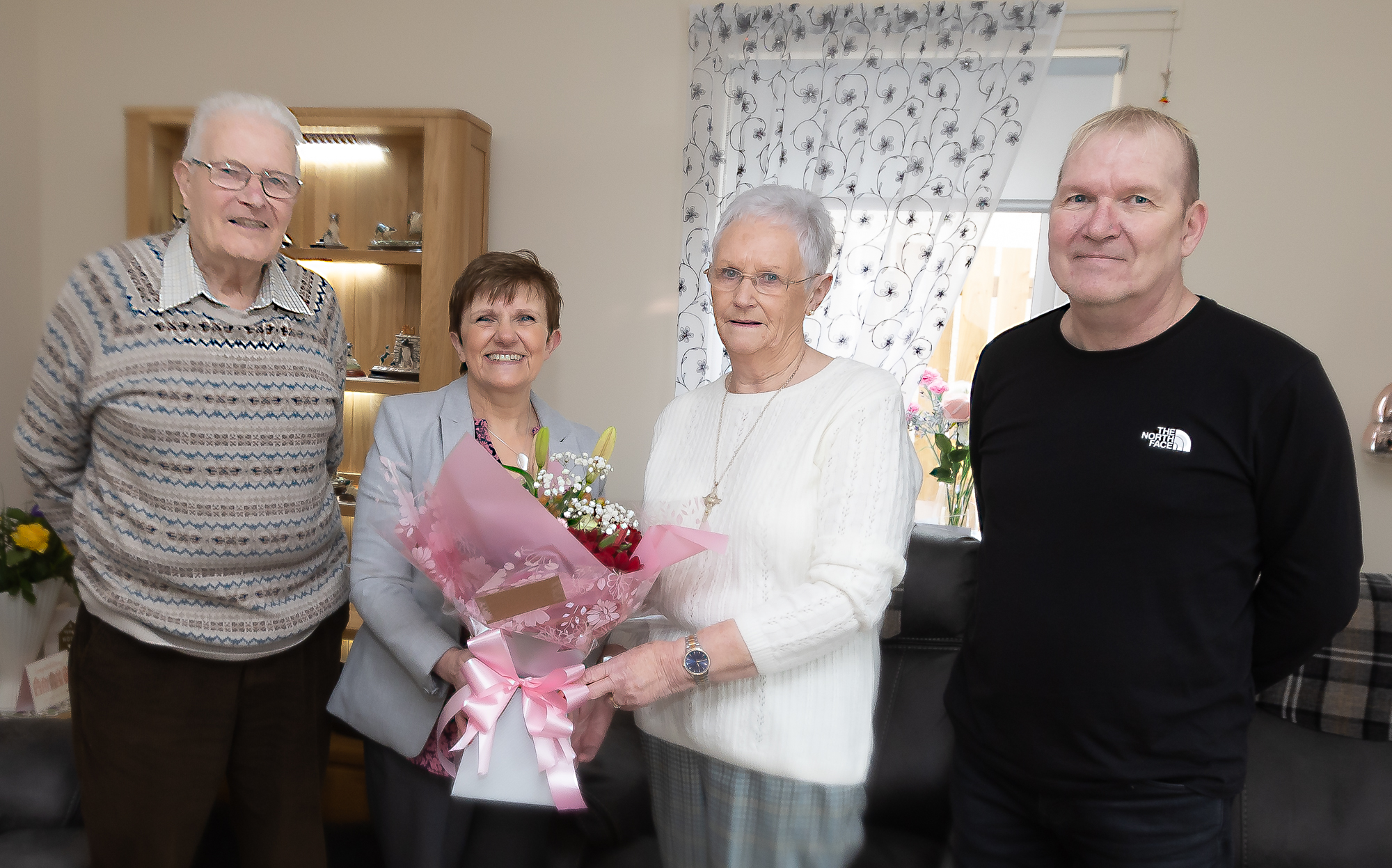 Council tenants, Mr and Mrs Young with Cllr Judy Hamiton and Callum Kay, Retirement Housing Officer