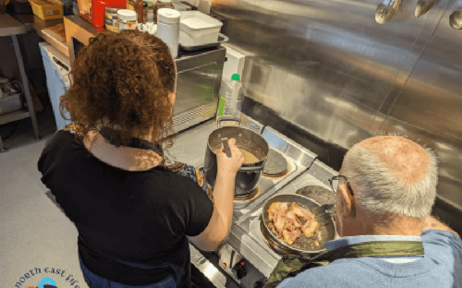 Volunteer chefs cooking in kitchen
